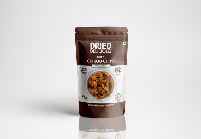 Stacks of sweet dried chikoo chips with rich caramel color on a light beige background with dramatic minimalist shadows